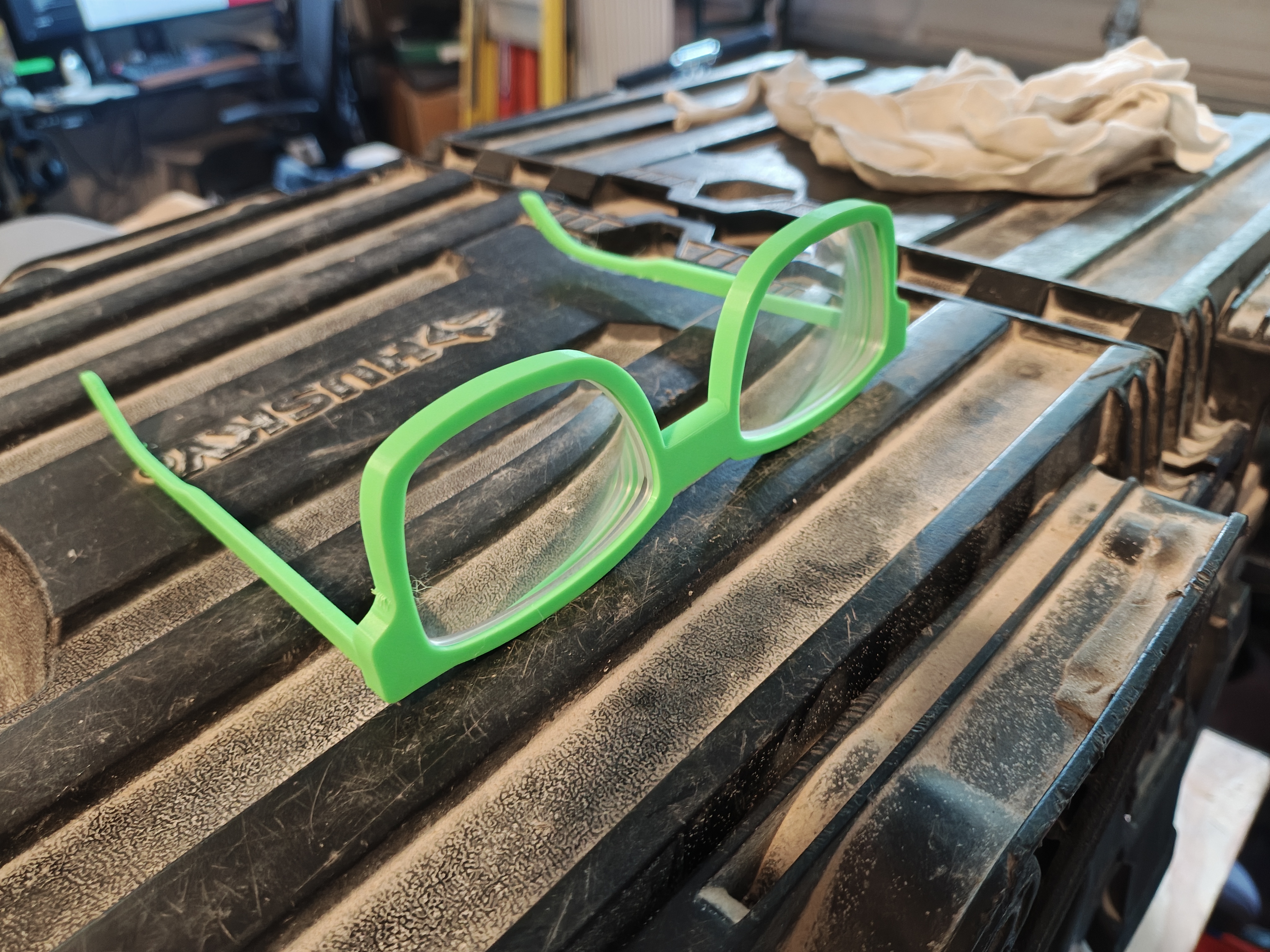 Completed green glasses frames on toolbox