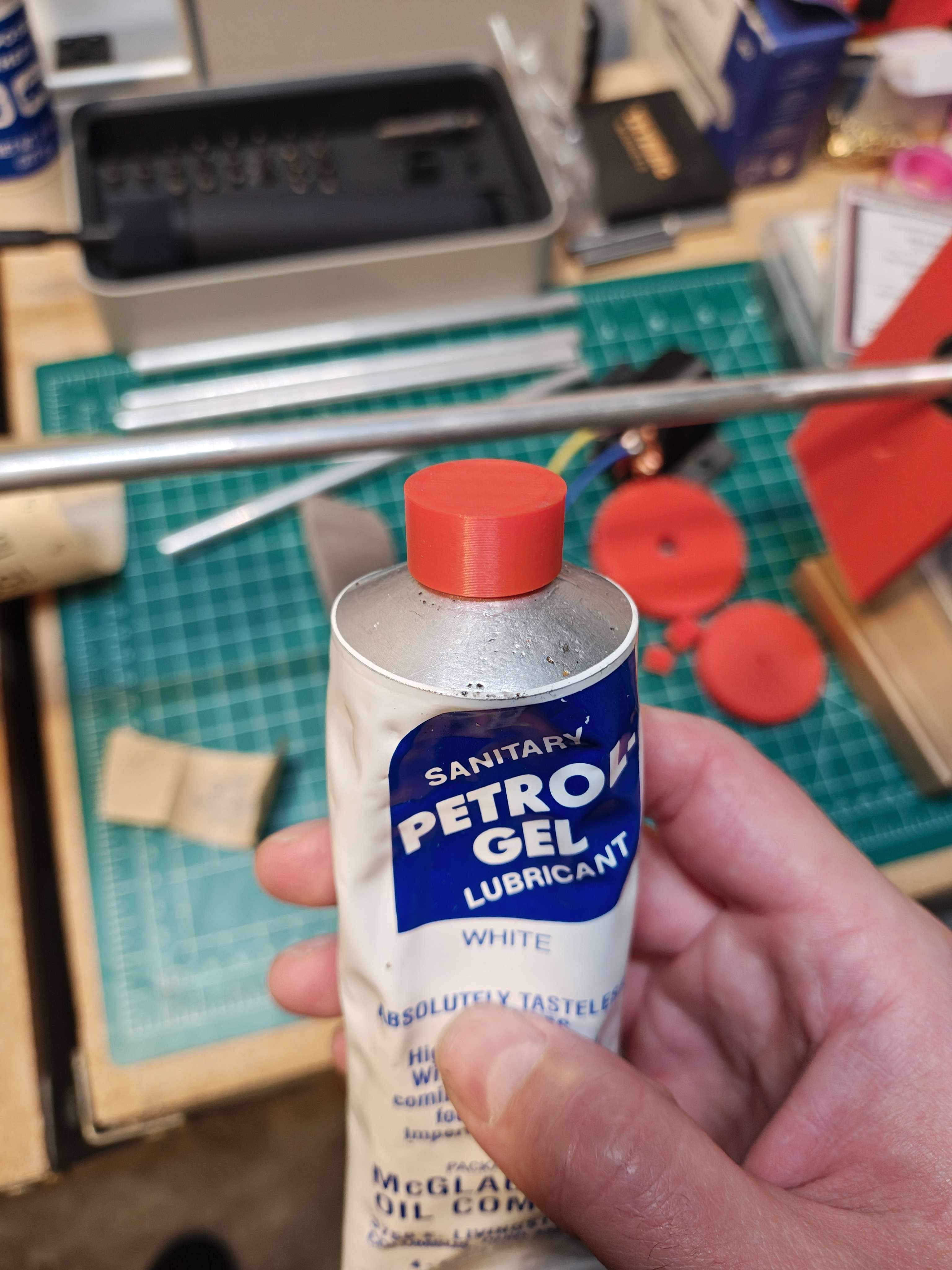 3D printed red cap on a Petrol-Gel lubricant tube