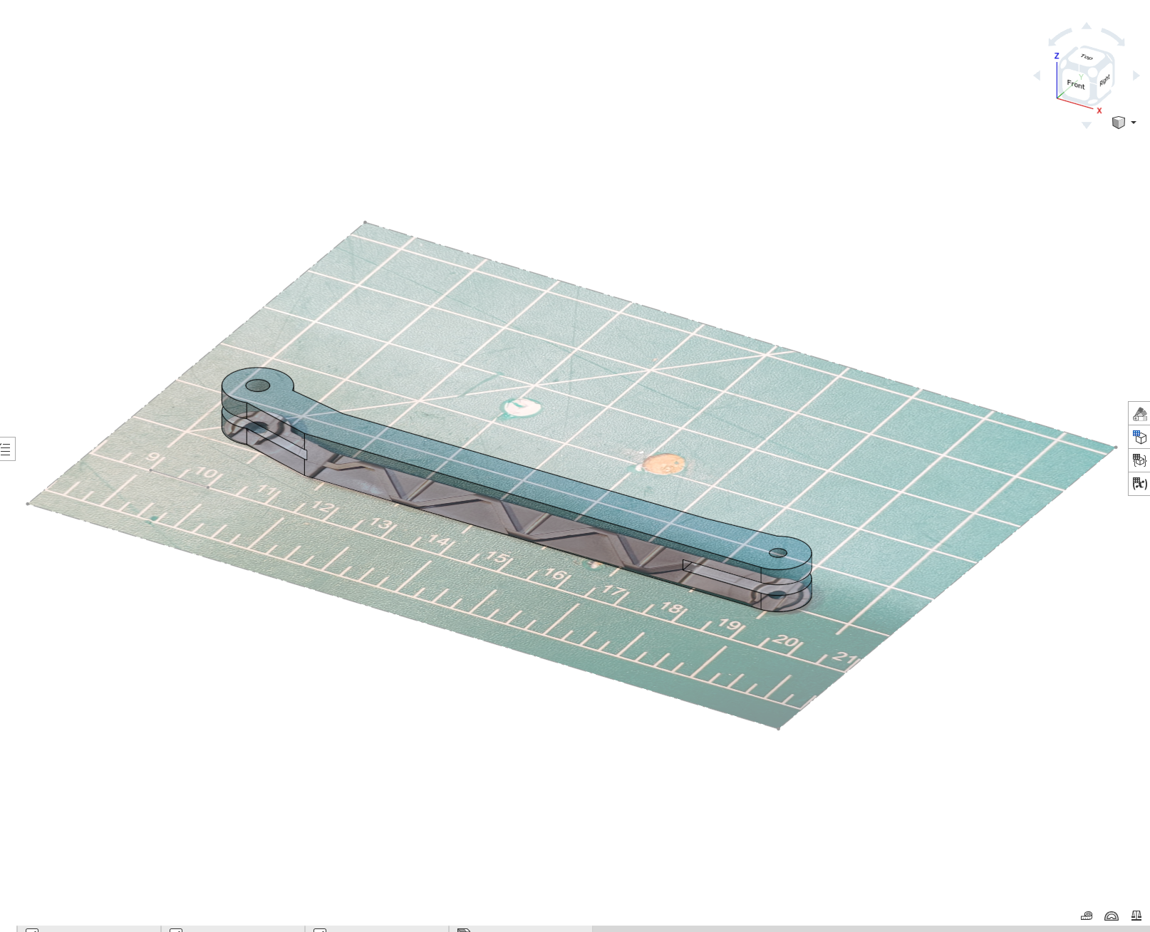 CAD model of grabber linkage overlaid on photo, front view