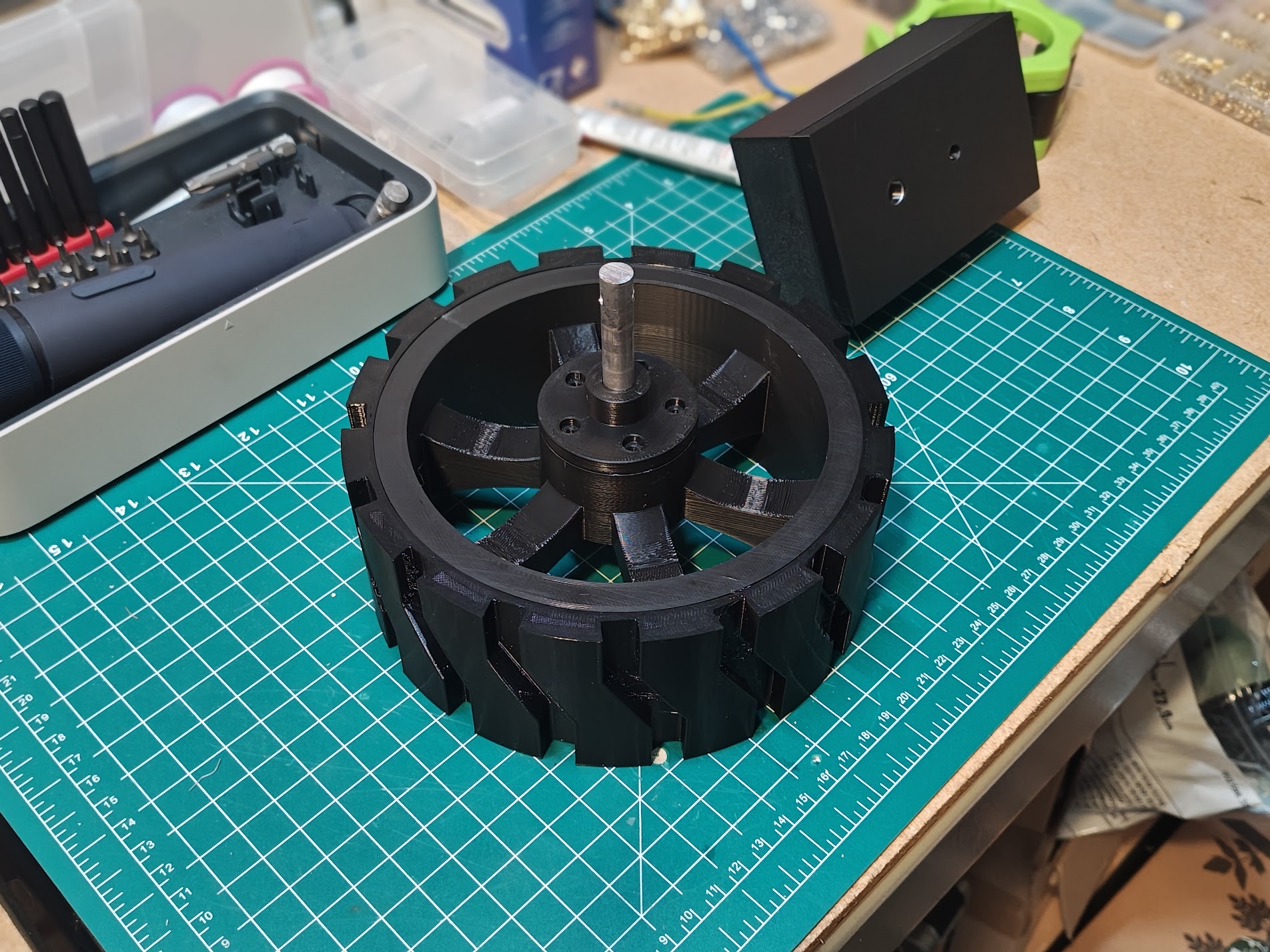 Wheel hub mounted inside black wheel with knobby tire